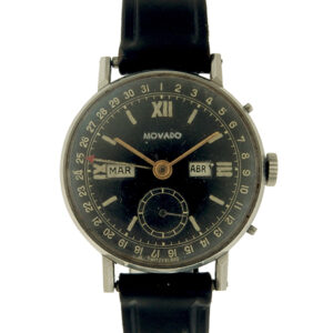 Movado Round Stainless Steel Vintage Calendar Wristwatch w/ black dial and Spanish day/month indexes.