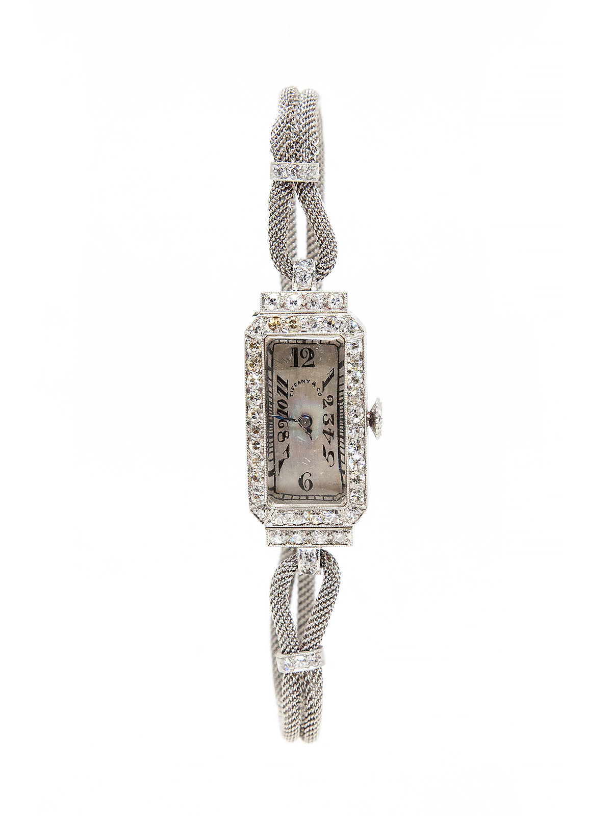 Patek Philippe lady's platinum bracelet watch, retail for Tiffany&Co. with diamond bezel, c. 1920's